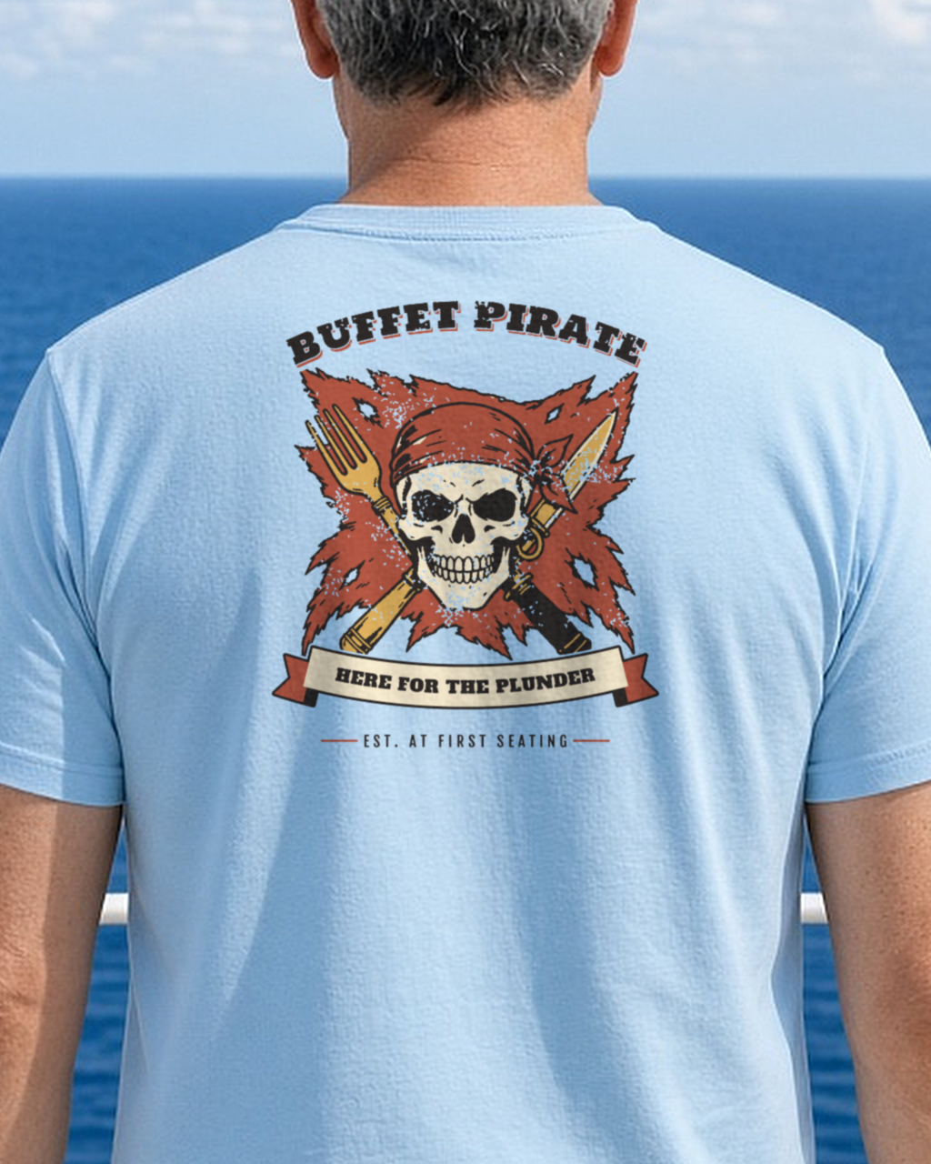 Mockup: baby blue Buffet Pirate tee, back print, worn on an open ship deck